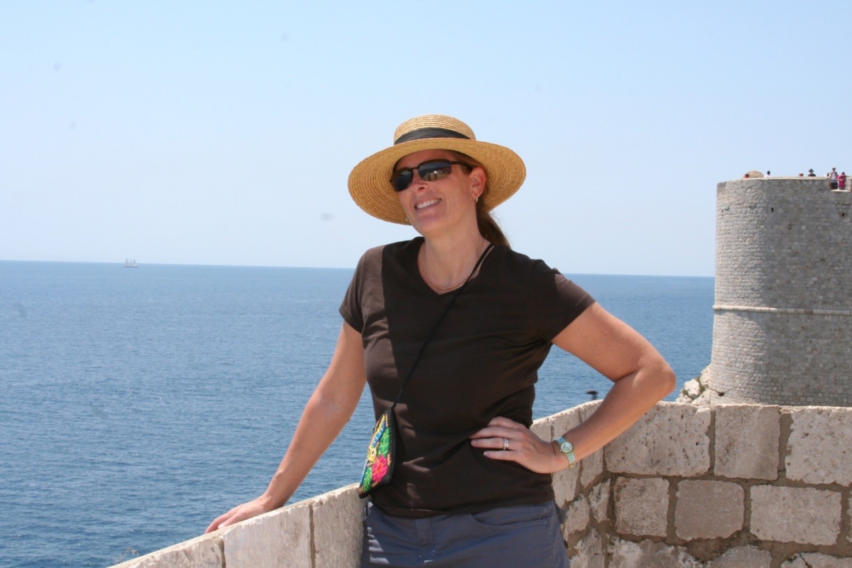 Lisa Benton-Short standing on a castle wall