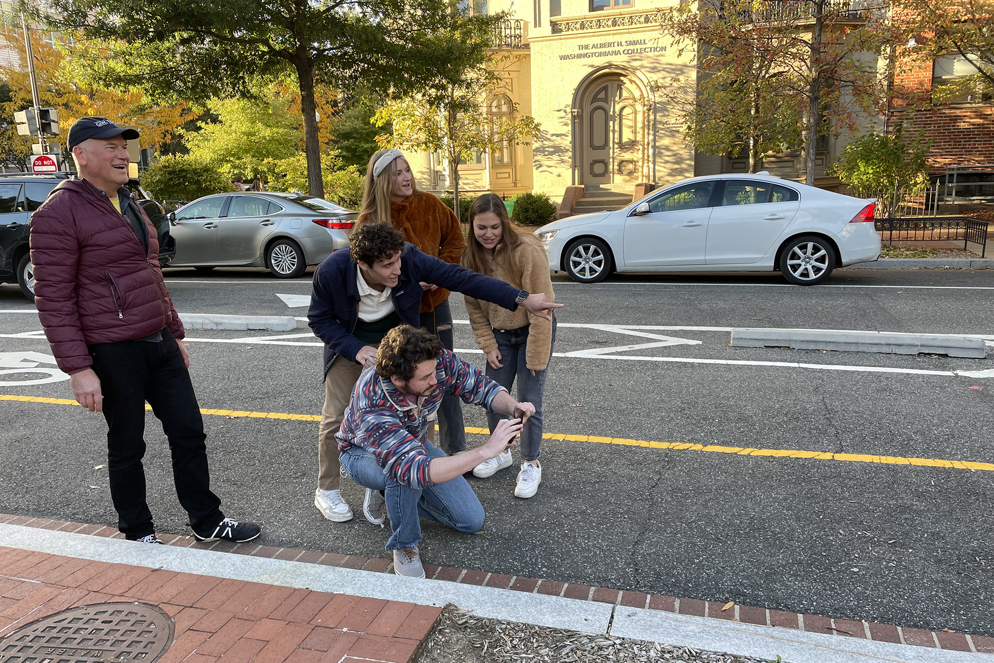 Professor Rain with students on streets of DC.