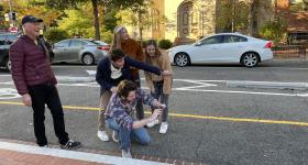 Professor Rain with students on streets of DC.